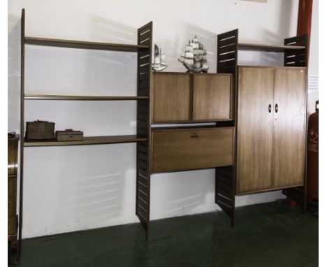 A retro teak wall unit with ladder sides, inset cupboards and bureau desk
