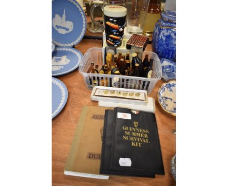 A selection of Guinness advertising items including ceramic sugar bowl and cover