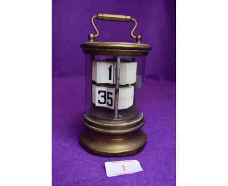 A 1930's desktop flip ticket clock by Ever Ready the Chronos Clock having glass and brass case
Untested.