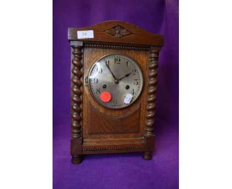 An oak cased bracket clock having brass face dial and chime
