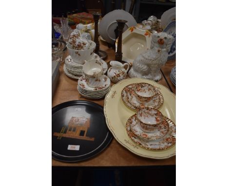A part tea service un marked and similar ceramics including Staffordshire pot dog