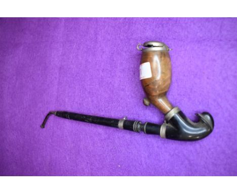 A Victorian opium smokers pipe having ebony shaft with a burr wood formed bowl