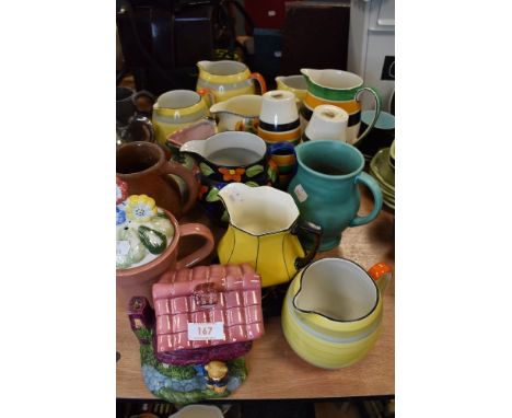 A selection of various ceramic water jugs including art deco designs and Grays pottery