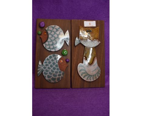 Two mid century design ceramic wall tiles by Hornsea Pottery in a John Clappison design depicting fish and a cat