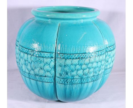 Large pottery planter or jardiniere of pumpkin form with incised designs on an aquatic blue ground, 45cm diameter.   CONDITIO