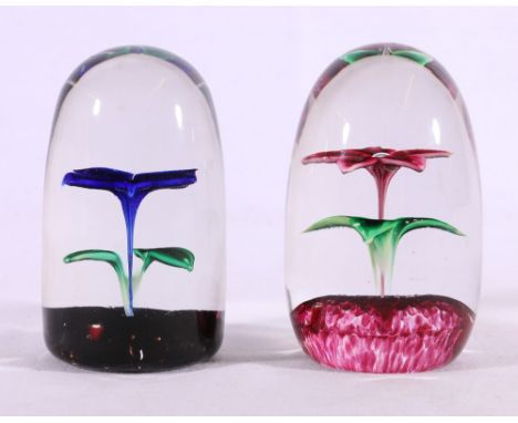 Two Strathearn art glass paperweights with posy centre of dump shape, each with 75 rod in base, , 9.5cm.   CONDITION REPORT: 