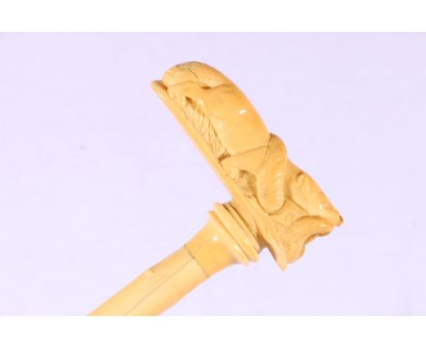 19th century carved ivory section walking stick, the handle modelled as a mongoose and snake on carved simulated tree branch 