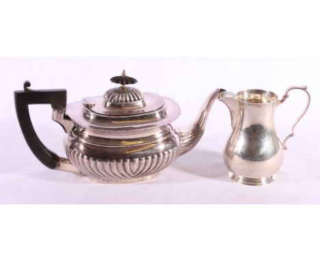 George VI silver cream jug, Sheffield 1938 makers Harrison Brothers and Howson, 265g also an electroplated teapot.