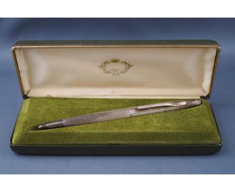 A silver mounted and engine turned biro, engraved 'J.R.C. Gough', Birmingham 1976, in a box.