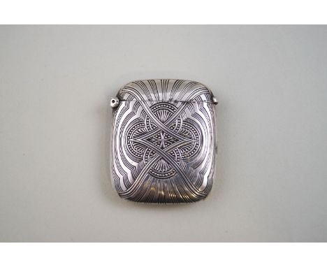 An early 20th century French silver vesta case/match safe, engraved with a central shell and bead quatrefoil, crossed with re