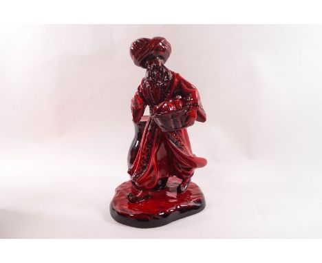 A Flambe Royal Doulton figure 'The Lamp Seller' HN3278