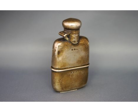 A silver oblong small hip flask with a hinged twist-cover and a removable cup, Birmingham 1920 by Marples & Beasley, 8.5cm hi