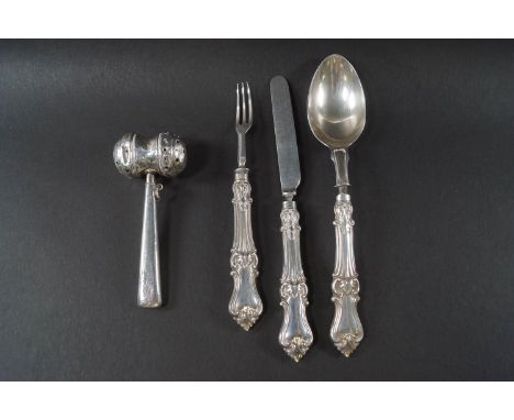 A baby's silver mallet-shaped rattle, Birmingham 1925, the maker's mark rubbed, 9cm long, 19 grams gross; together with a Vic