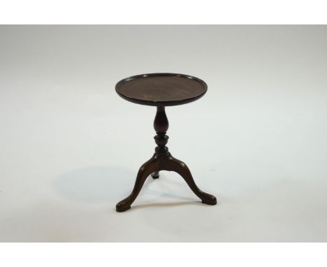 An 19th century mahogany miniature tripod table, 33cm high