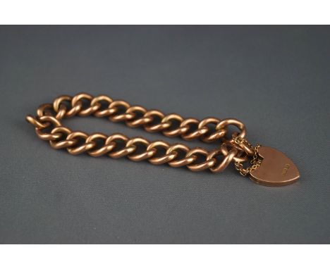 An early 20th century rose gold hollow curb bracelet, stamped '9', on a padlock clasp stamped '9c', 18.5 grams gross, in a sh