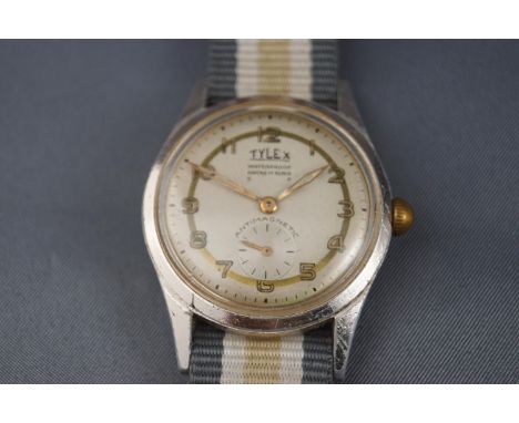 Tylex, a 1950's stainless steel wrist watch, the round silvered dial with raised gilt Arabic numerals, pierced hands and subs