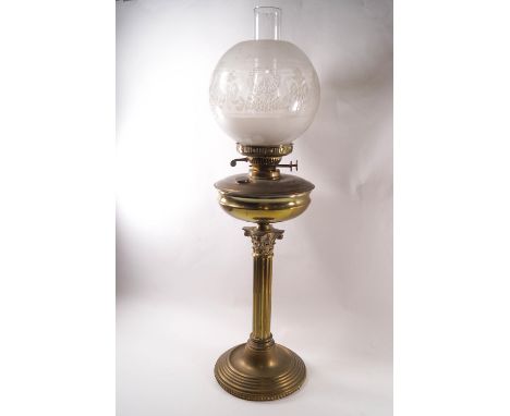 A Victorian brass Corinthian column oil lamp, with funnel and engraved globe shade, 72cm high