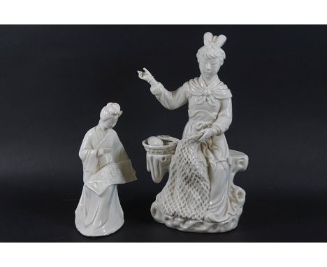 A Chinese porcelain blanc de chine figure of a seated woman repairing a fishing net, 21.5cm high, and a smaller blanc de chin