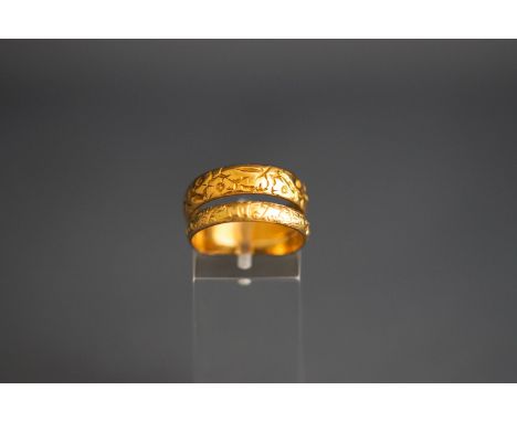 Two gold rings, comprising; a 22ct gold floral engraved wedding band, London 1963 by William Wilkinson Ltd, size Q, 5.3 grams