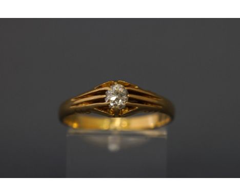 An early 20th century 18ct gold and diamond solitaire gypsy ring, the old-cut stone approx. 0.33cts, claw set in a tapering s