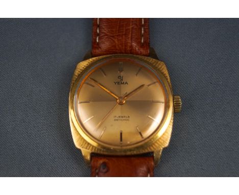 Yema, a 1970's gold-plated oblong wrist watch, the round golden dial with raised gilt baton numerals and hands, two-piece par