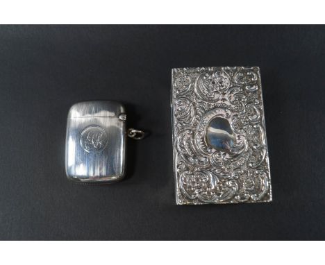 A silver vesta/match case with engine turned bands, Birmingham 1919 by Joseph Gloster Ltd; together with a large matchbox hol