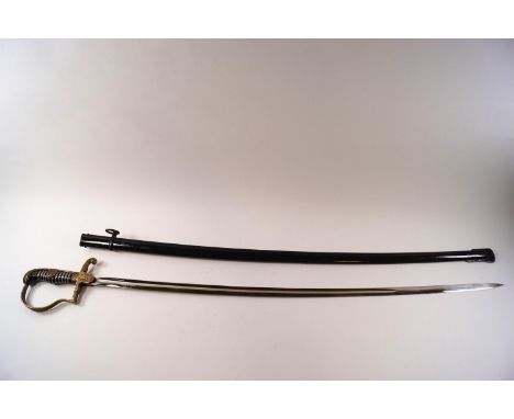 A WWI German Officer's sword, the blade engraved Eickhorn, Solingen, the wire bound grip and brass hilt with acorn leaf decor
