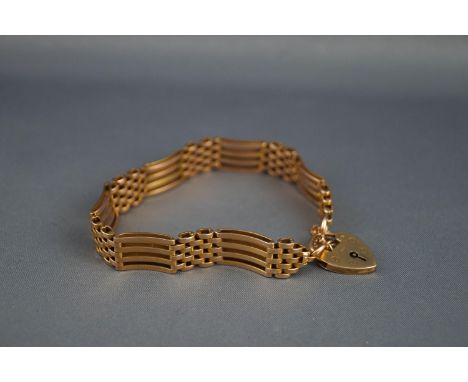 A 9 carat gold box and gate bracelet on a padlock clasp, London 1964, 21.5 grams