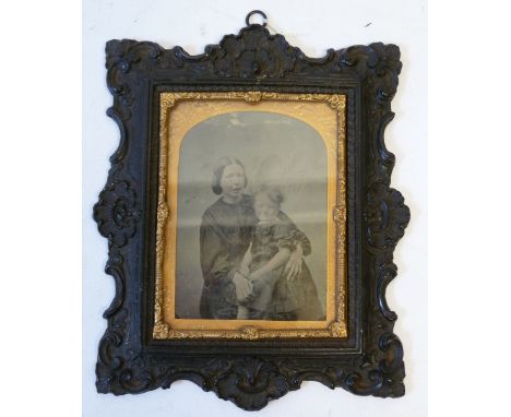 A VICTORIAN AMBROTYPE PORTRAIT PHOTOGRAPH OF BENJAMIN CHARLES BREARLEY as a child seated on his mother's knee (Sarah Brearley