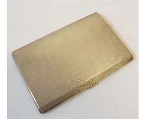 CAPTAIN CHARLES FREDERICK LOCK'S SILVER ART DECO STYLE POCKET CIGARETTE CASE, OBLONG AND ENGINE TURNED, the long borders slop