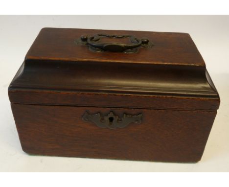 GEORGE III MAHOGANY TEA CADDY, sarcophagus shaped with brass swing handle surmounting, and shaped brass lock plate, the three