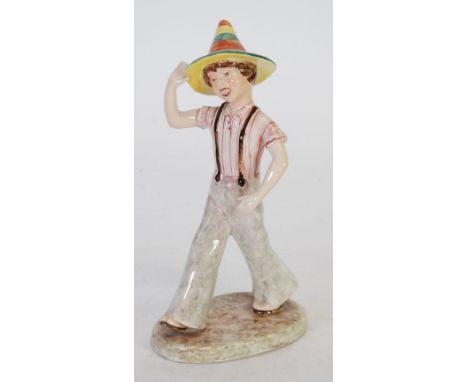 LATE GOLDSCHEIDER POTTERY FIGURE modelled as a striding boy wearing a conical hat, 9" (22.8cm) high, black printed mark, Made