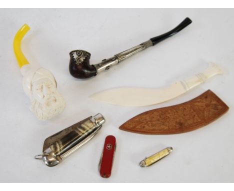 MODERN CARVED MEERSCHAUM PIPE, the bowl carved with a bearded man in a turban, with imitation amber mouth piece, A METAL MOUN