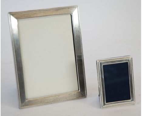 MODERN SILVER FRONTED PHOTOFRAME, engine turned with beaded border, 8 1/8" x 6 1/8" (20.6cm x 15.5cm), import London 1974, AN