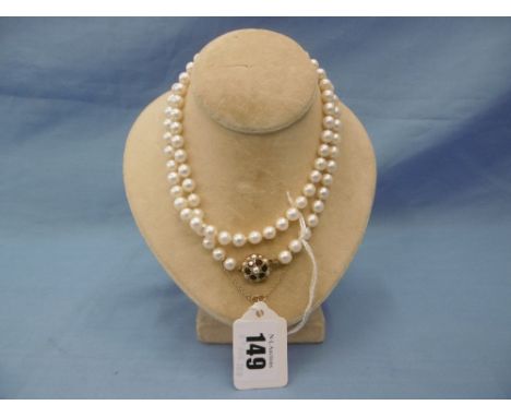 A pearl necklace with 9ct gold clasp set with pearls and rubies