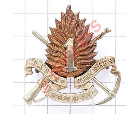 Indian Army, Parsee Bombay Pioneers scarce cap badge. British made die-stamped crossed rife and pick, sumounted my flame bear