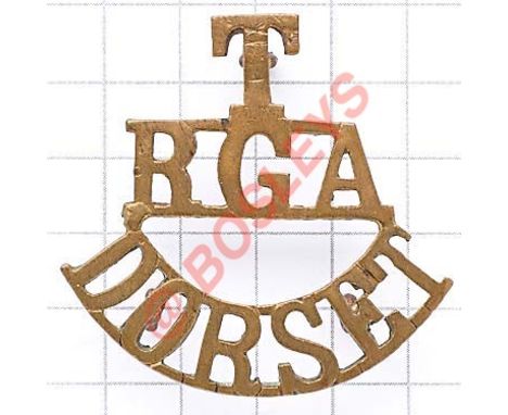 T / RGA / DORSET brass Royal Garrison Artillery shoulder title circa 1908-20. Loops Defended Port Battery HQ Weymouth