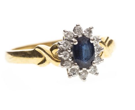 BLUE GEM AND DIAMOND CLUSTER RING, set with a central oval faceted blue gem 5.7mm long and surrounded by round diamonds, on X