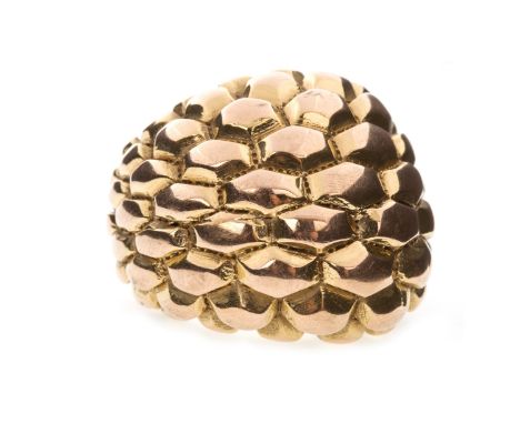 BOMBE STYLE DRESS RING, the large bezel moulded in relief with sections similar to a pinecone, marked 750, size R 1/2, 7.4g