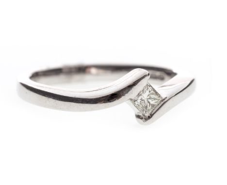 DIAMOND SINGLE STONE RING, with a single tension set princess cut diamond of approximately 0.10 carats to a twist setting, si