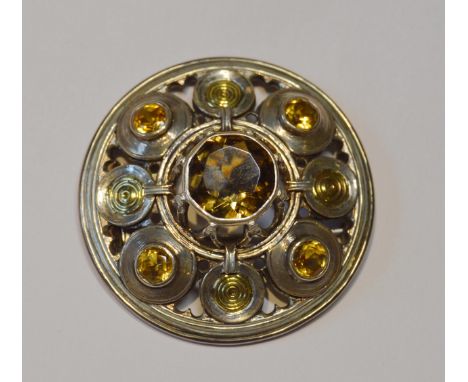 Robert Crerar (Scottish)&nbsp;Silver circular brooch of Celtic shield form with gold and cairngorms, 47mm diameter, 37.1g gro