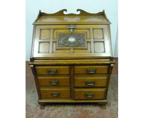 Edwardian Thomson's Patent oak bureau with pierced galleried top, panelled fall front with presentation plaque opening to rev