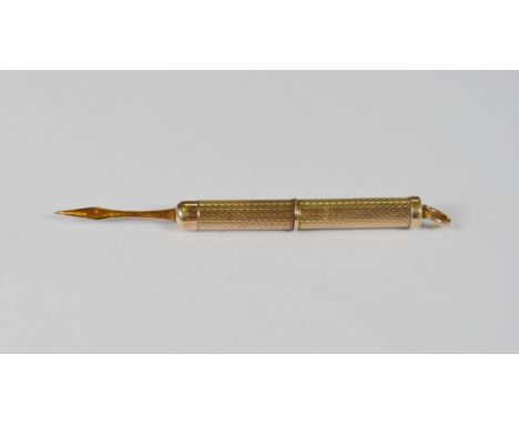 9ct gold propelling toothpick with engine-turned decoration, 5.3cm long, 7.1g gross.
