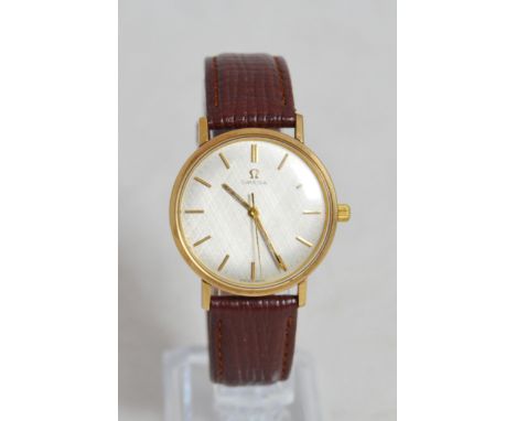 Omega 9ct gold gent's automatic wristwatch, originally purchased in 1968, the silvered dial with gold baton indices, case dia