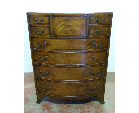 Mahogany bowfront chest of drawers with a central deep drawer flanked by two short drawers, above four long graduated drawers