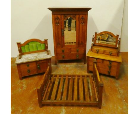 Rare Art Nouveau-style oak four-piece bedroom suite, made for dolls, comprising a mirror-door wardrobe, decorated with carved