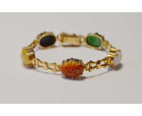 Cropp &amp; Farr 9ct gold bracelet with five scarab-style carved ovals in various colours, to include a jade cabochon, 19g gr