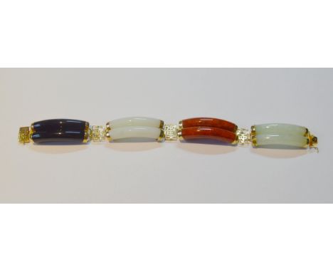 Chinese coloured jade baton bracelet of four curved links, in 14ct gold, 37g gross.