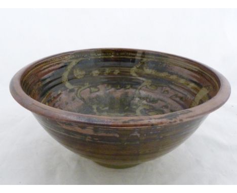 David Leach (1911 - 2005) Large studio stoneware bowl with all over wax resist decoration in tenmoku and colourful glaze, on 