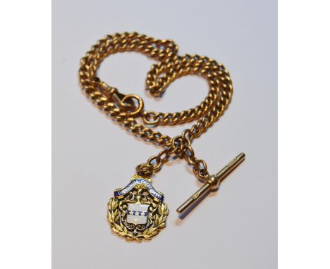 9ct gold curb-link watch guard with T-bar, 33g, and attached 15ct gold and enamel medal fob, approximately 9g, 39.4g gross.